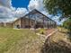The screened-in patio features a brick floor and offers a seamless indoor/outdoor living experience at 13248 Linzia Ln, Spring Hill, FL 34609