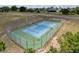 Well-maintained community tennis court surrounded by secure fencing at 13248 Linzia Ln, Spring Hill, FL 34609