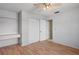 Bedroom featuring flooring, neutral walls, and built-in closet at 13307 Woodward Dr, Hudson, FL 34667