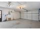 Spacious garage with neutral walls and open garage door at 13307 Woodward Dr, Hudson, FL 34667