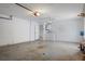 Spacious garage featuring laundry area, water heater, and ample room for storage and parking at 13307 Woodward Dr, Hudson, FL 34667
