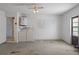 Garage with ceiling fan, doorway to home interior, and utility hookups at 13307 Woodward Dr, Hudson, FL 34667