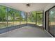 Enclosed sun room provides an incredible view of the backyard and great lighting at 13307 Woodward Dr, Hudson, FL 34667