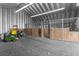 Barn interior with horse stalls and ample room for equipment and livestock at 14031 Hexam Rd, Brooksville, FL 34613