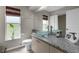 Elegant bathroom featuring a modern vessel sink and plenty of natural light at 14031 Hexam Rd, Brooksville, FL 34613