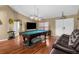 Spacious game room featuring a pool table and ample space for entertaining guests at 14031 Hexam Rd, Brooksville, FL 34613