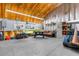 Spacious garage featuring high ceilings and ample storage space for hobbies and recreational vehicles at 14031 Hexam Rd, Brooksville, FL 34613