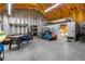 Inside the garage featuring a golf cart, recreational games, and separate storage rooms at 14031 Hexam Rd, Brooksville, FL 34613