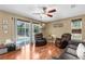 Bright living room with sliding doors to the pool area and comfortable seating at 14031 Hexam Rd, Brooksville, FL 34613
