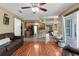 Open concept living room leading to a modern kitchen and dining area at 14031 Hexam Rd, Brooksville, FL 34613
