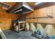 A functional workshop area with wooden walls, workbench, and storage solutions at 14031 Hexam Rd, Brooksville, FL 34613