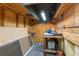 Another view of workshop space, with a work table, and plenty of wall and floor storage at 14031 Hexam Rd, Brooksville, FL 34613
