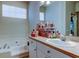 Spacious bathroom with a large countertop, jacuzzi tub and mirror at 14466 Tamarind Loop, Spring Hill, FL 34609