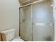 Enclosed shower featuring a clear glass door at 14466 Tamarind Loop, Spring Hill, FL 34609
