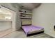 Spare bedroom with built-in shelving and open access to other rooms at 14466 Tamarind Loop, Spring Hill, FL 34609