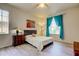 Cozy bedroom featuring ample natural light and soothing decor at 14466 Tamarind Loop, Spring Hill, FL 34609