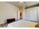 Bedroom with a full-sized bed with an ensuite bathroom and closet at 14466 Tamarind Loop, Spring Hill, FL 34609