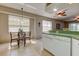 A dining area with tile floors and a nearby window at 14466 Tamarind Loop, Spring Hill, FL 34609