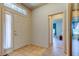 Foyer featuring neutral tile, high ceilings, and lots of natural light at 14466 Tamarind Loop, Spring Hill, FL 34609