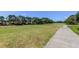 Scenic view of the lush golf course from the property line at 14466 Tamarind Loop, Spring Hill, FL 34609