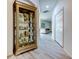 Hallway with gray wood floors leading to the living area at 14466 Tamarind Loop, Spring Hill, FL 34609