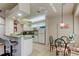Open floor plan showing the kitchen and dining area with a breakfast bar at 14466 Tamarind Loop, Spring Hill, FL 34609