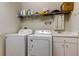 Laundry room featuring a washing machine, dryer, and sink at 14466 Tamarind Loop, Spring Hill, FL 34609