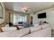 Open living room featuring sliding glass doors leading to a screened patio at 14466 Tamarind Loop, Spring Hill, FL 34609