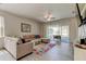 Bright living room leading to a screened lanai perfect for relaxing outdoors at 14466 Tamarind Loop, Spring Hill, FL 34609