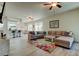 Spacious living room leading into a kitchen and dining area, great for entertaining at 14466 Tamarind Loop, Spring Hill, FL 34609