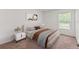Cozy bedroom with a large window and neutral tones at 15414 Green Jay Rd, Weeki Wachee, FL 34614