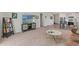 Spacious living room with TV, decor, and an open layout at 15414 Green Jay Rd, Weeki Wachee, FL 34614