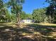 Charming home surrounded by beautiful trees and lush greenery at 15548 Rockingham Ln, Spring Hill, FL 34610