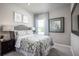 Bedroom featuring a comfortable bed with side tables and a view from the window at 1681 W Palms Dr, Port Charlotte, FL 33953