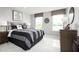 This bedroom features two windows, modern colors, and unique decor with a sports theme at 1705 W Palms Dr, Port Charlotte, FL 33953