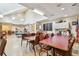 A spacious room with tables and chairs provides a versatile area for various activities at 18223 Nestlebranch Ct, Hudson, FL 34667