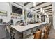 Upscale bar with large countertop, multiple TVs, liquor shelves, wooden beams, and ample seating at 18223 Nestlebranch Ct, Hudson, FL 34667