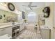 Spacious bathroom with double vanity, soaking tub, and separate shower, creating a spa-like retreat at 18223 Nestlebranch Ct, Hudson, FL 34667