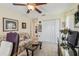 This comfy bedroom features carpet, floral sofa, and double door closet at 18223 Nestlebranch Ct, Hudson, FL 34667