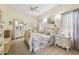 Charming bedroom featuring elegant furnishings, soft lighting, and a tranquil ambiance at 18223 Nestlebranch Ct, Hudson, FL 34667