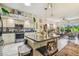 Well-designed kitchen with stainless steel appliances, granite counters, and an open layout at 18223 Nestlebranch Ct, Hudson, FL 34667