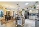 Bright kitchen with hardwood floors, stainless steel appliances, a central island, and an open design at 18223 Nestlebranch Ct, Hudson, FL 34667