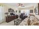 Comfortable office space features wood furnishings, floral sofa and carpet at 18223 Nestlebranch Ct, Hudson, FL 34667