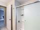 Bathroom featuring a glass-enclosed shower with frosted doors and tile surround at 18902 Saint Laurent Dr, Lutz, FL 33558