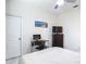 Functional bedroom with a work space and a TV for relaxation, offering versatility and comfort at 18902 Saint Laurent Dr, Lutz, FL 33558