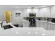 Well-lit kitchen features quartz countertops, white cabinetry, and stainless steel appliances at 18902 Saint Laurent Dr, Lutz, FL 33558