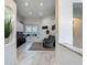 Bright living room with tile floors, large windows, and neutral decor at 18902 Saint Laurent Dr, Lutz, FL 33558