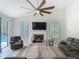 Bright living room with fireplace and backyard pool view at 18902 Saint Laurent Dr, Lutz, FL 33558