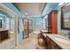 Bathroom features granite counters, double sinks, bathtub, and a glass shower at 19418 Morden Blush Dr, Lutz, FL 33558