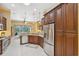 Bright kitchen features stainless appliances, granite counters, and dark wood cabinetry at 19418 Morden Blush Dr, Lutz, FL 33558